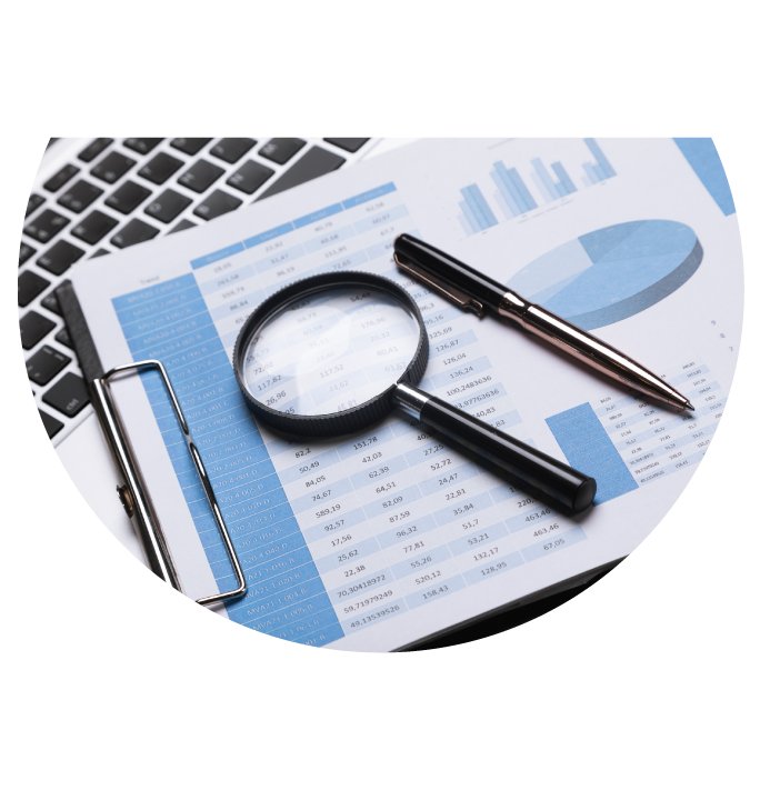 Stocks Detail Sheet with Magnifying glass and pen